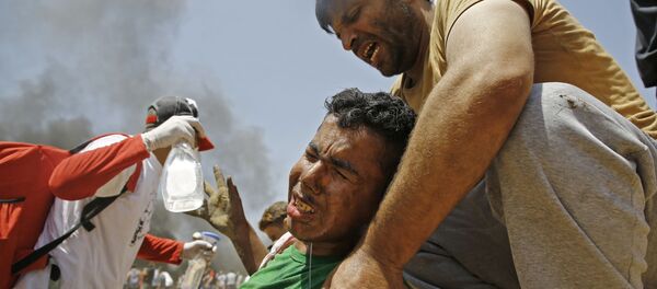 درگیری مردم فلسطین با نظامیان اسرائیلی در غزه - اسپوتنیک ایران  