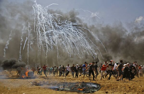 درگیری مردم فلسطین با نظامیان اسرائیلی در غزه - اسپوتنیک ایران  