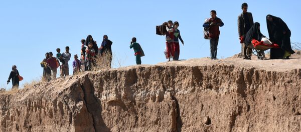 انتقال خانواده های داعشی از سوریه به عراق انتقال خانواده های داعشی از سوریه به عراق - اسپوتنیک ایران