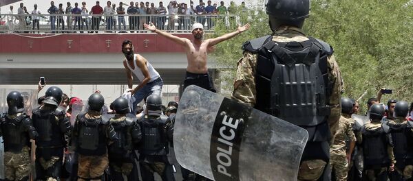 افزایش تعداد کشته شدگان و مجروحین اعتراضات عراق - اسپوتنیک ایران  