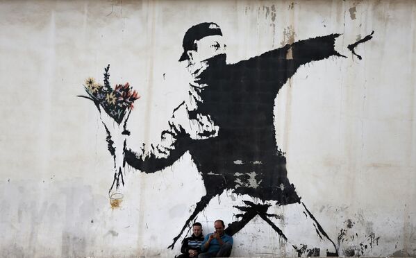 گرافیتی نقاش بنکسی در بیت الحم - اسپوتنیک ایران  