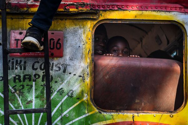 پسربچه در اتوبوس در هائیتی - اسپوتنیک ایران  