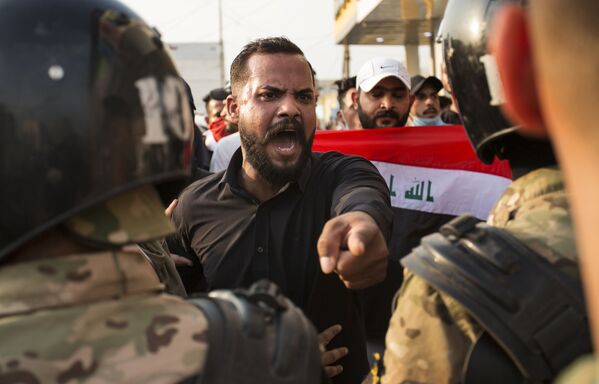 اعتراضات در بغداد به  خونریزی کشیده شد  - اسپوتنیک ایران  