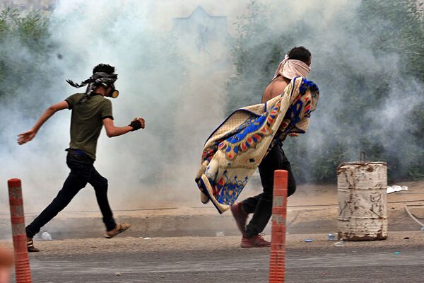 اعتراضات گسترده ضد دولتی در عراق به روایت تصویر   - اسپوتنیک ایران  