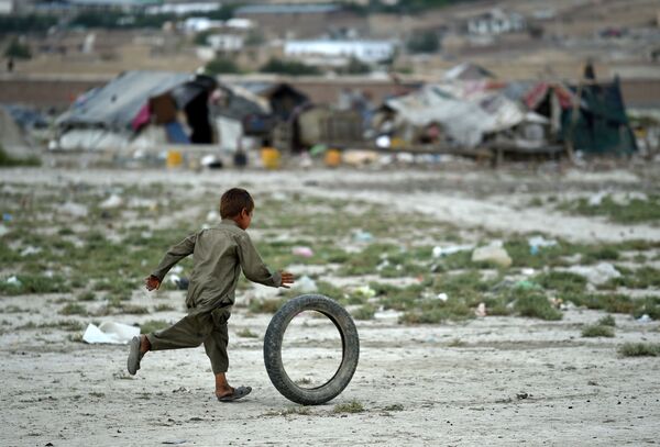 پسربچه افغان  در  حال بازی - اسپوتنیک ایران  