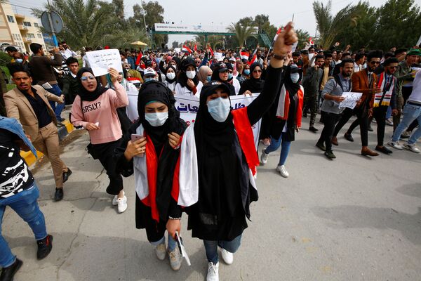 در عراق مردم برای مقابله با کرونا ماسک می زنند  - اسپوتنیک ایران  