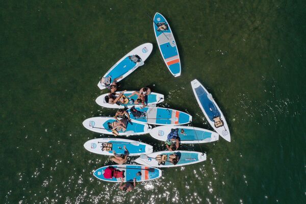 جوانان در قایق هایشان در دریاچه لیدی برد در تگزاس - اسپوتنیک ایران  